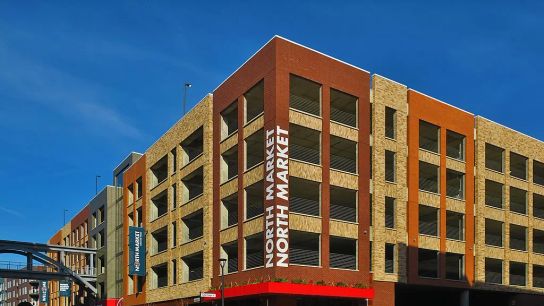 Dublin’s government found ways to enable the development of multistory parking in Bridge Park, eliminating the need for large surface parking lots. Dublin’s government found ways to enable the development of multistory parking in Bridge Park, eliminating the need for large surface parking lots.