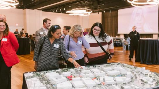 A 3C model of the Metro Center plan on display at a community meeting. A 3C model of the Metro Center plan on display at a community meeting.