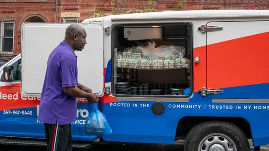A meal deliverer for one of Citymeals’ partner agencies gets ready to deliver meals to recipients’ homes.