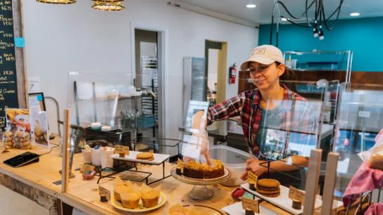 Jessica Larriva puts away baked goods at Tumbleweed Bread in Monte Vista, Colorado. Larriva sources all of her whole-grain flour from local farmers and millers, including rye flour, which she uses in many of her cookies.