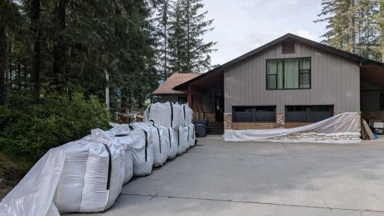 Sandbags are deployed by residents to protect their homes in anticipation of the next glacial flood in Juneau.