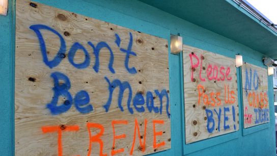 Signs are seen on a boarded-up restaurant in Kill Devil Hills, North Carolina, ahead of the expected landfall of Hurricane Irene in 2011.