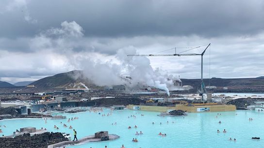 Steam from the Svartsengi geothermal power plant rises behind the Blue Lagoon. Steam from the Svartsengi geothermal power plant rises behind the Blue Lagoon.