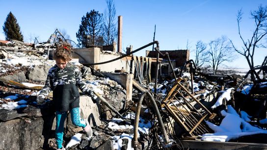 An 8-year-old walks through what remains of her grandfather’s house in a neighborhood decimated by the Marshall Fire in Louisville, Colorado. An 8-year-old walks through what remains of her grandfather’s house in a neighborhood decimated by the Marshall Fire in Louisville, Colorado.