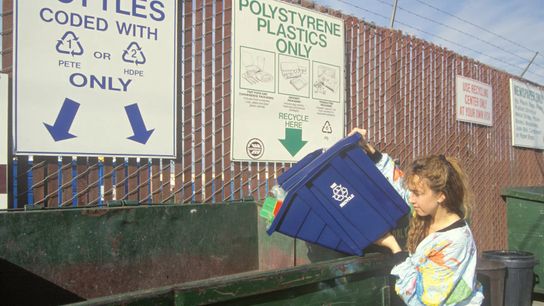 A woman sorts plastics at the Santa Monica Recycling Center in California in 1992.