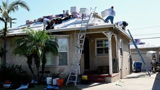 Thinking of Going Solar? Wait Until You Need a New Roof. (news). Photo by Brittany Murray / Long Beach Press-Telegram via Getty Images via Grist